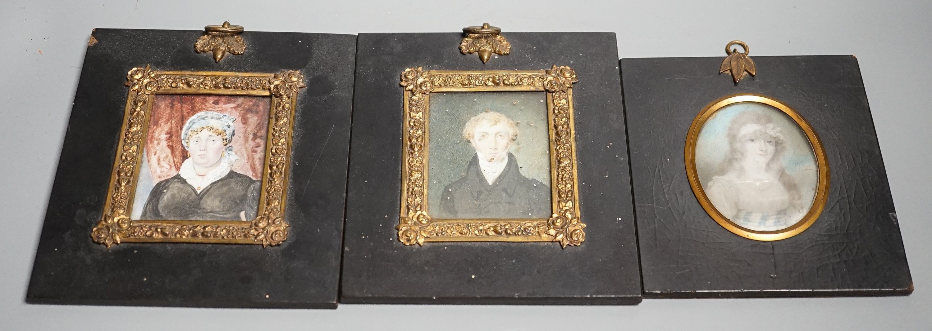 Attributed Richard Cosway R.A. (1742-1821); A portrait miniature on ivory of a lady, 7.7 cm x 6 and a pair of early 19th century portrait miniatures on Ivory of a gentleman and lady